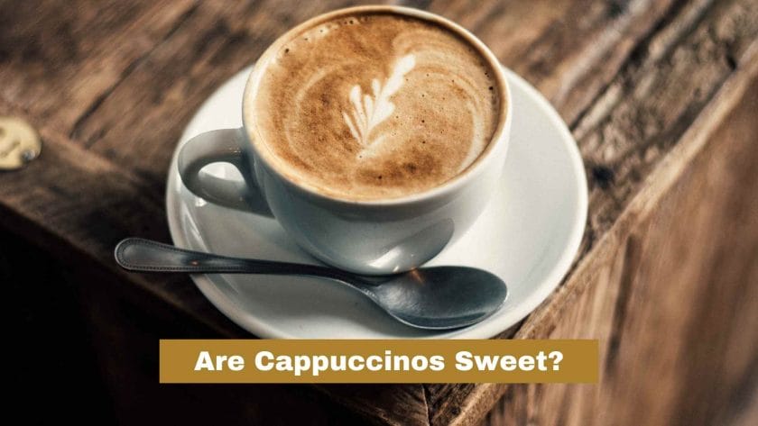 Photo of a cappuccino on top of a wooden table. Are Cappuccinos Sweet?