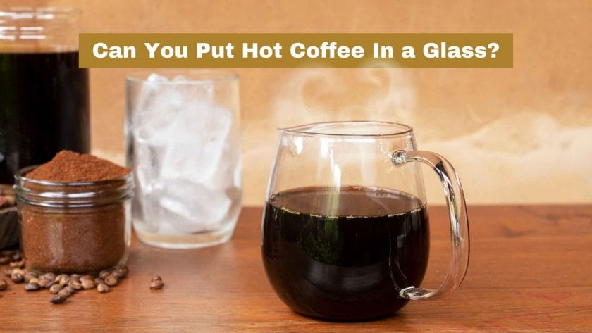 Photo of hot coffee in a glass with grinded coffee in a jar and some coffee beans on the table and a glass with ice in the back. Can You Put Hot Coffee In a Glass?