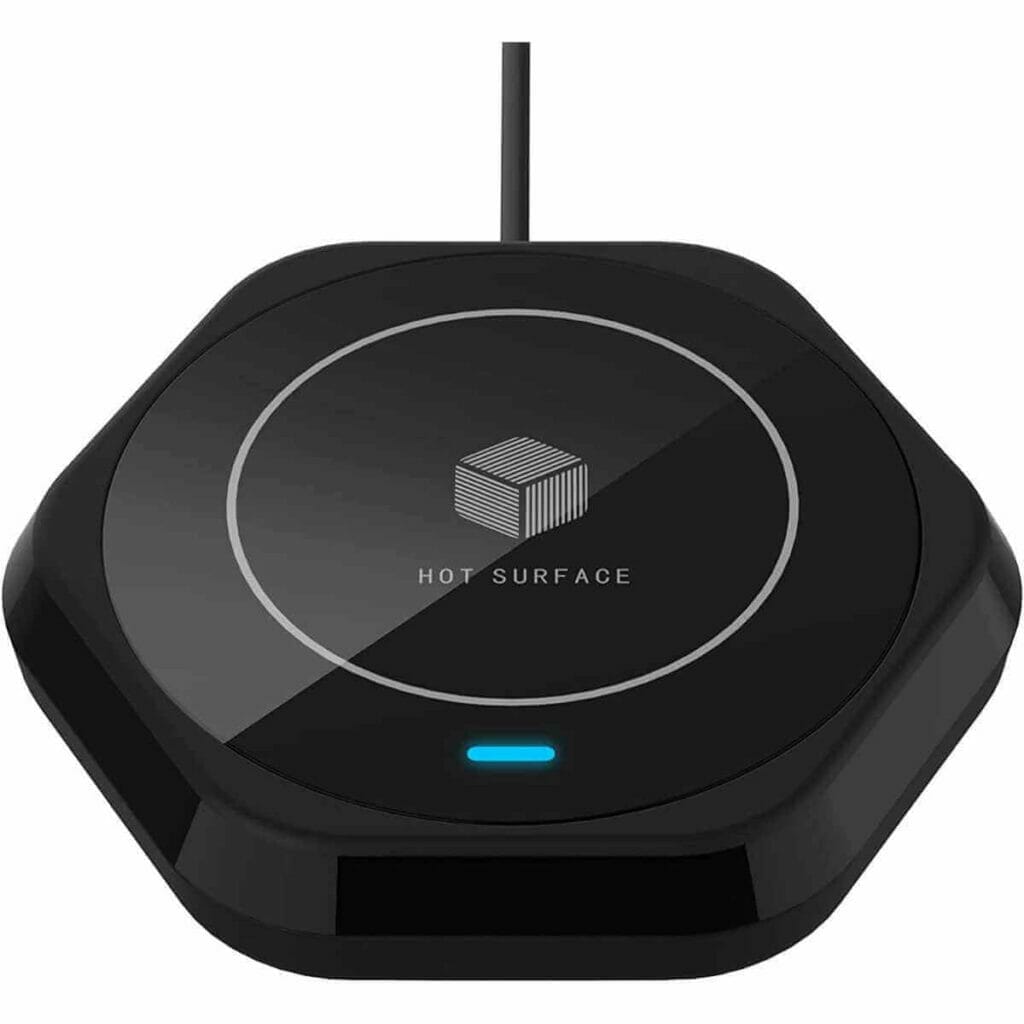 Photo of a black coffee mug warmer surface.