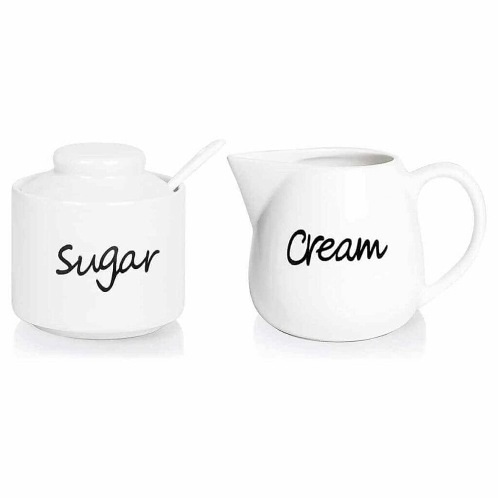 Photo of a sugar and cream white coffee set.