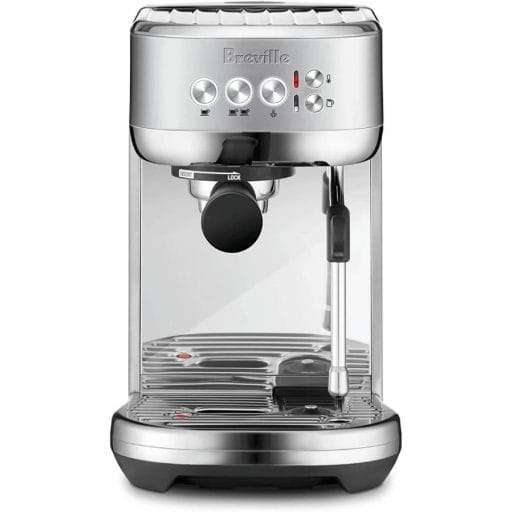 Photo of a silver Breville Bambino Plus Espresso Machine with steam wand and frothing temp control.