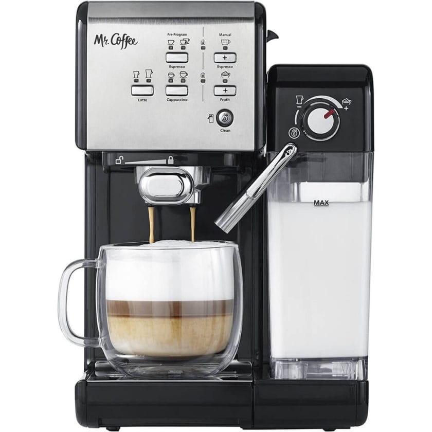 Photo of a black and silver Mr. Coffee Espresso Machine with a water and milk reservoir and milk steamer. Making a cappuccino.