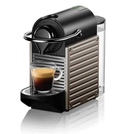 Photo of a champagne, black and silver Nespresso Pixie Espresso Machine.