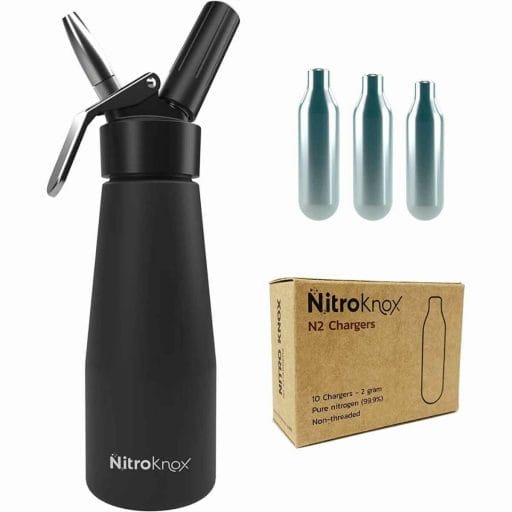 Photo of a black Nitro Cold Brew Coffee Kit by Nitroknox with the N2 cartridges.