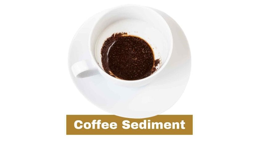 Photo of a white cup of coffee with coffee sediment in the bottom.